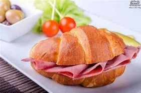 Ham, Goat Cheese, Black Olives & Baby Spinach Croissant Breakfast